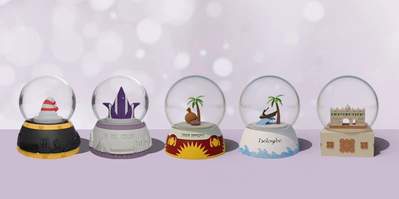 Snow globes featuring cultural symbols from Nigerian tribes, capturing the festive spirit of the holiday season.